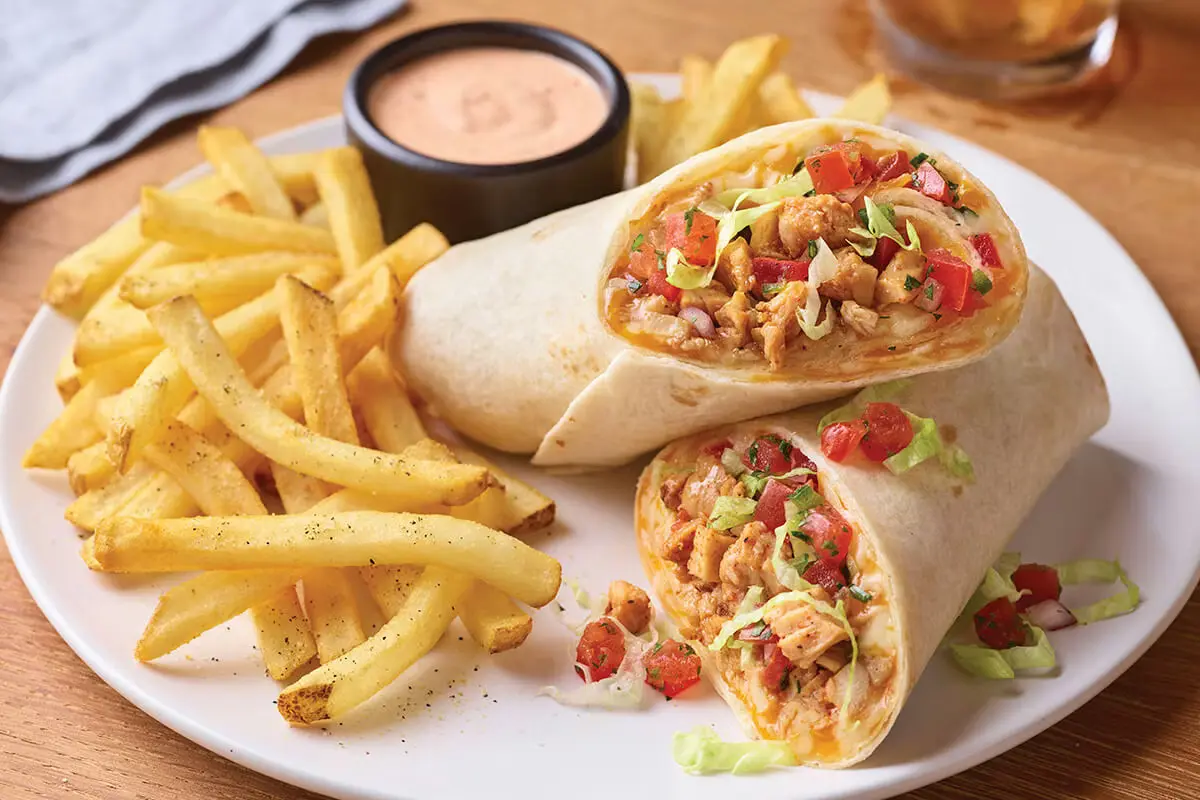 Grilled chicken fajita rollup with peppers wrapped in soft tortilla bread