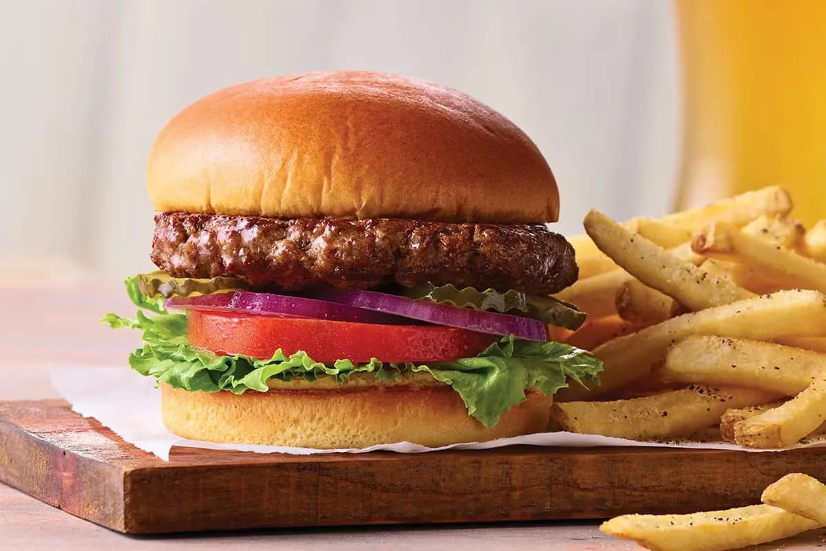 Classic beef burger with fresh lettuce, cheese, and soft toasted bun.