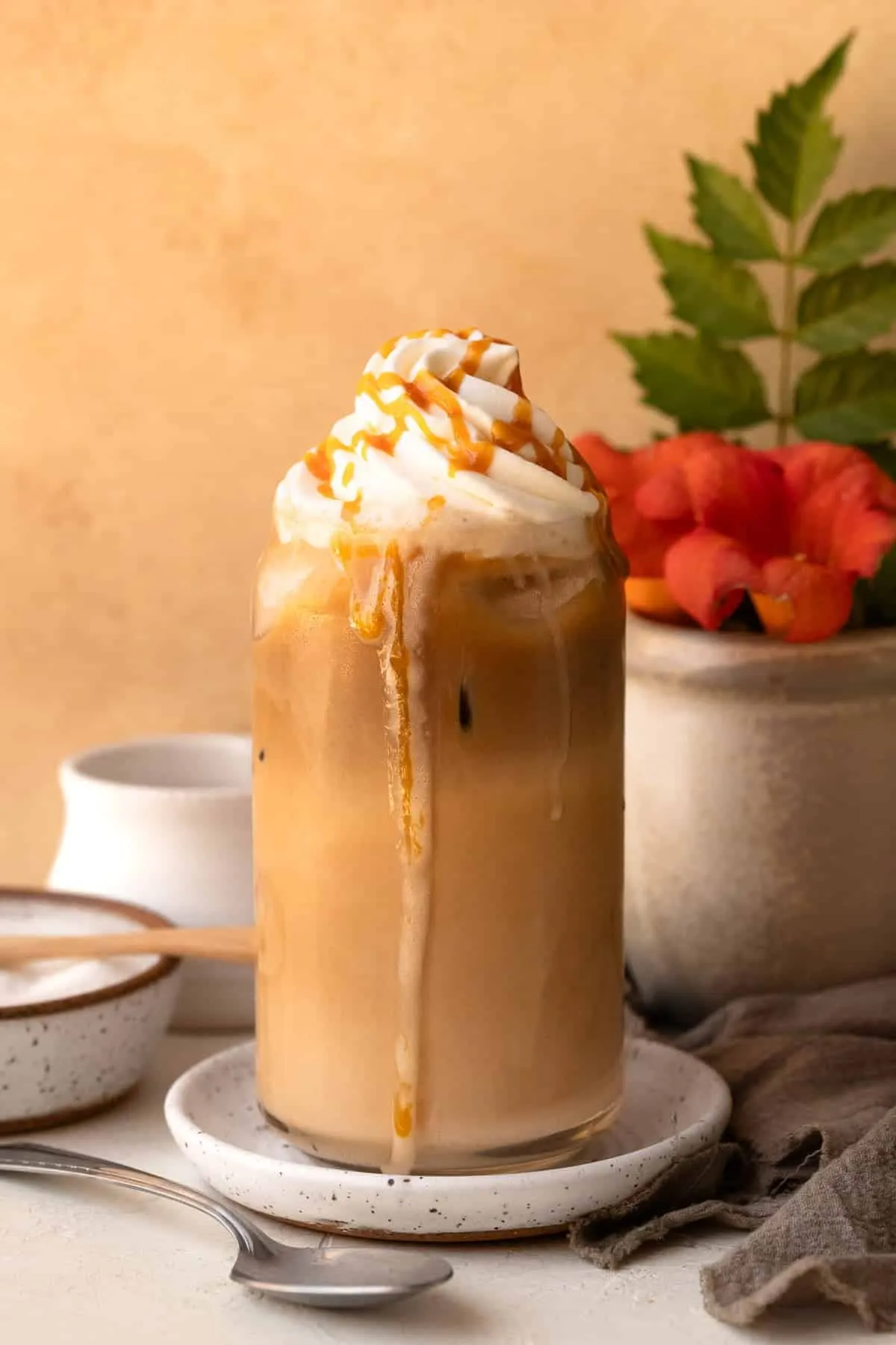 Cold coffee latte served with ice cubes and creamy texture