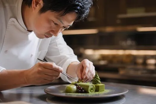 focused chef sit the dish